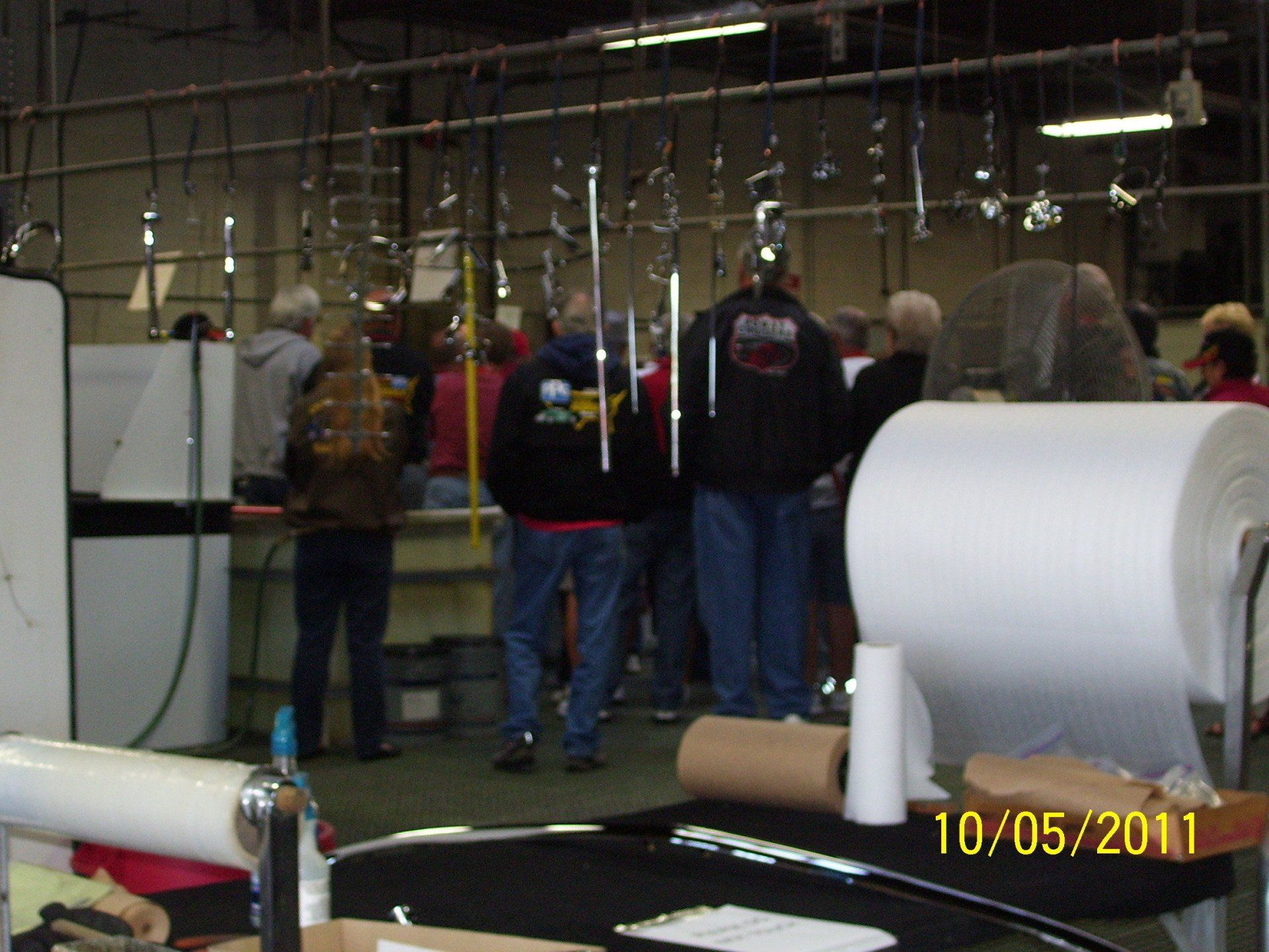 A photo of a group of people in a factory was taken on 10/05/11