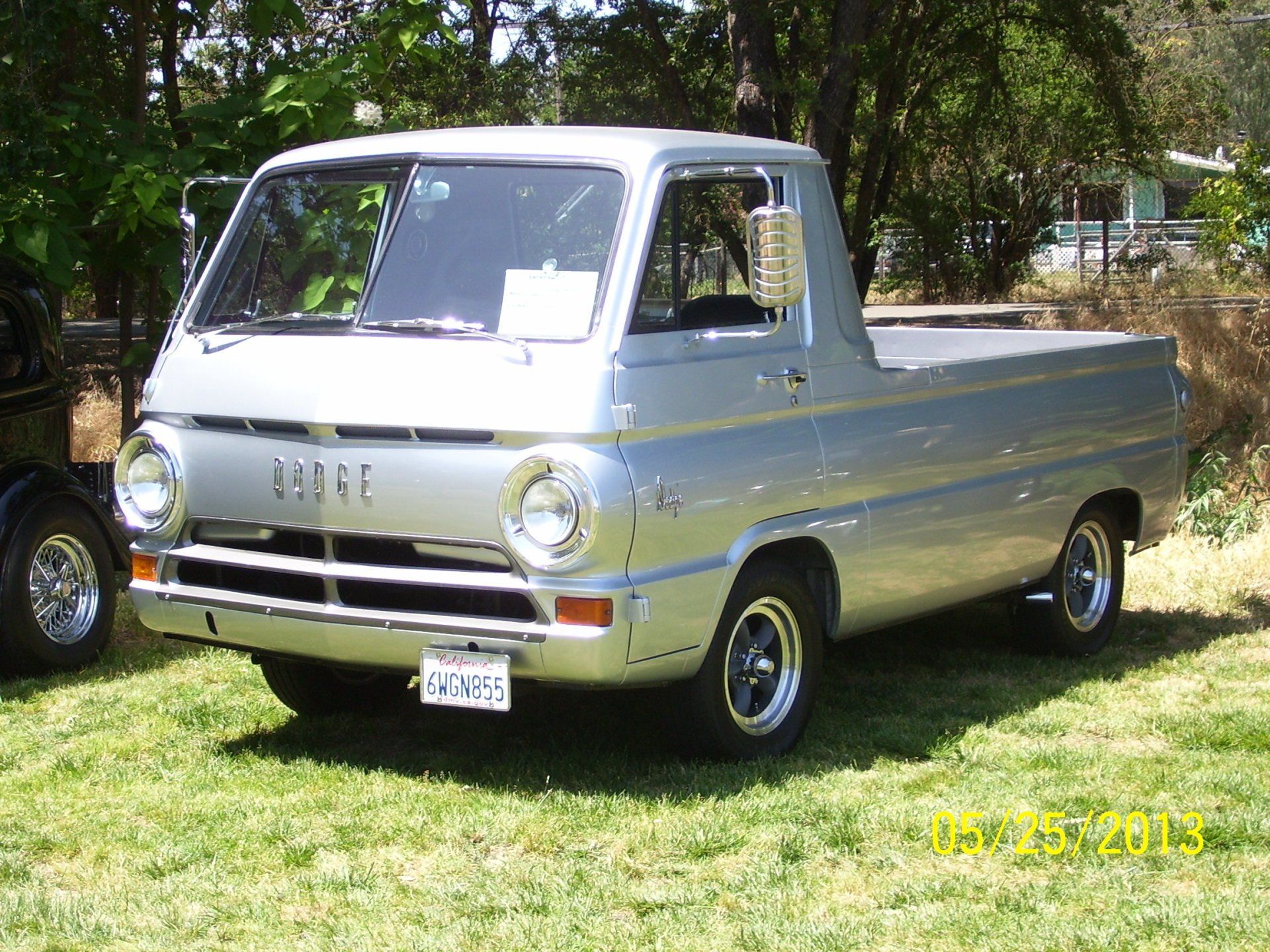 A silver ford truck is parked in the grass