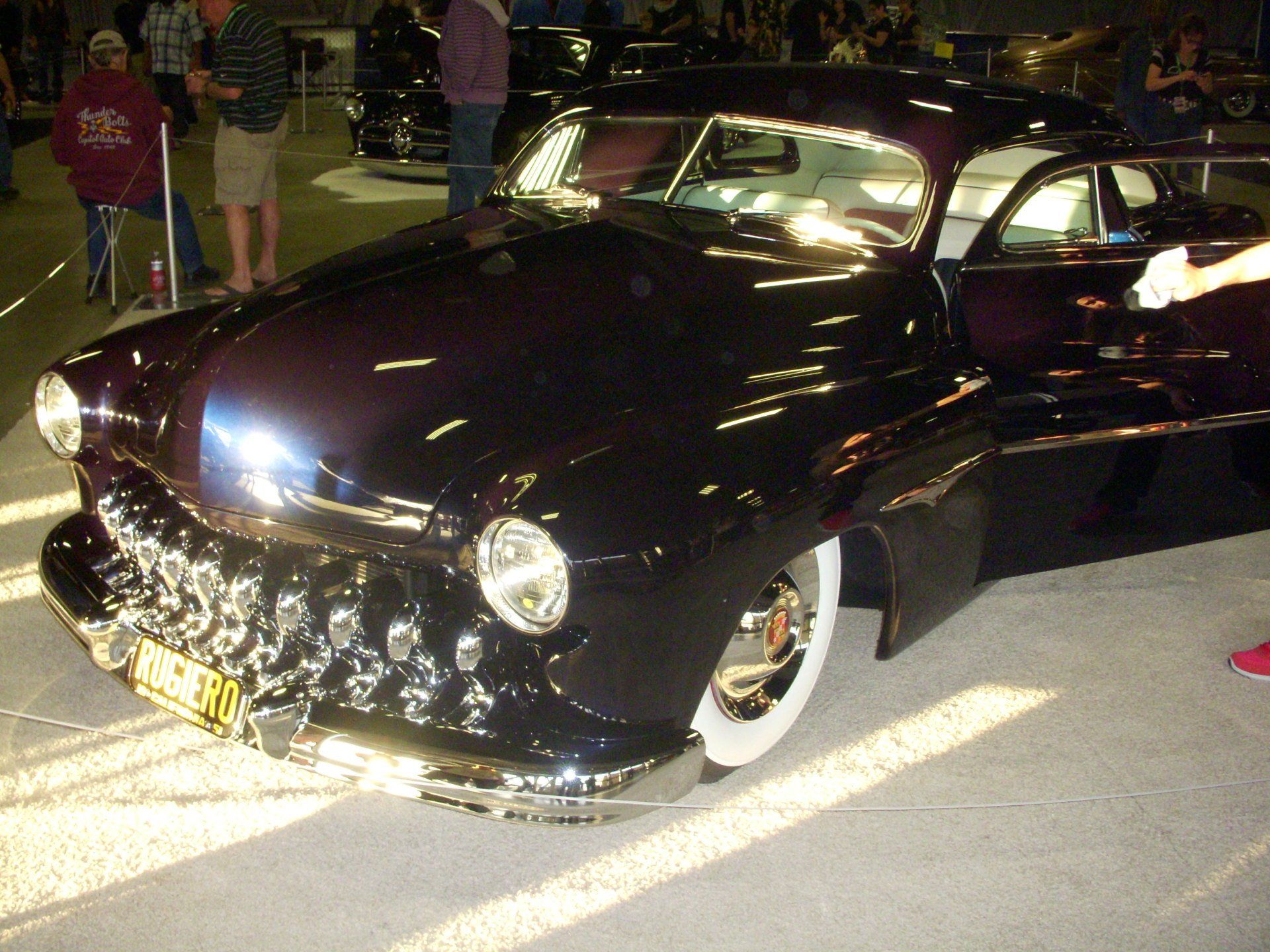 A purple car with a license plate that says ' nc ' on it