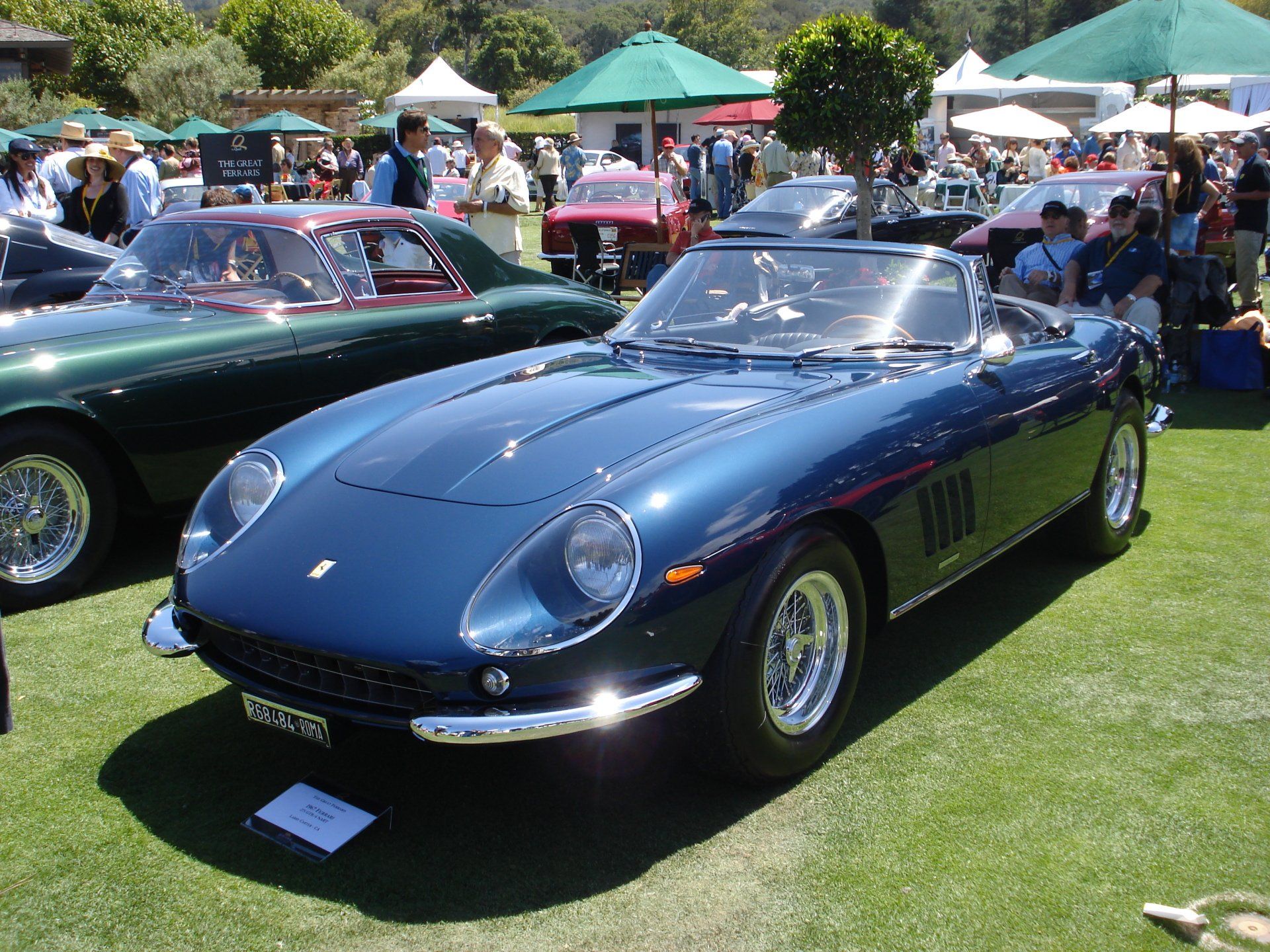 A blue sports car with a license plate that says ' sd ' on it