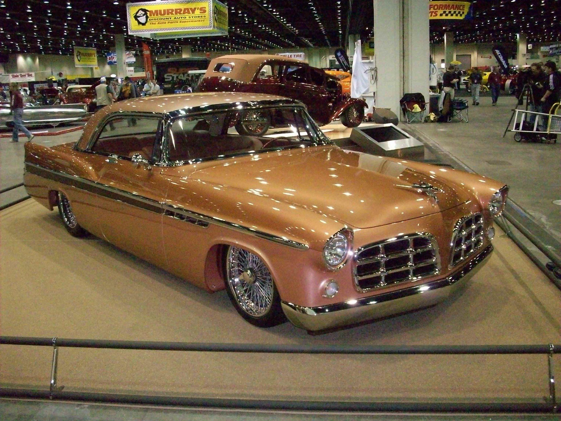 A chrysler car is on display at a car show
