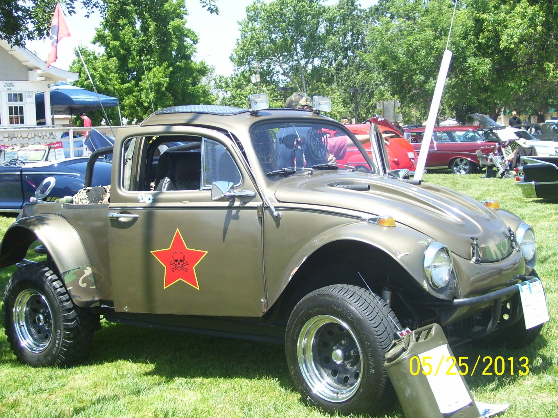 A volkswagen beetle with a red star on the side