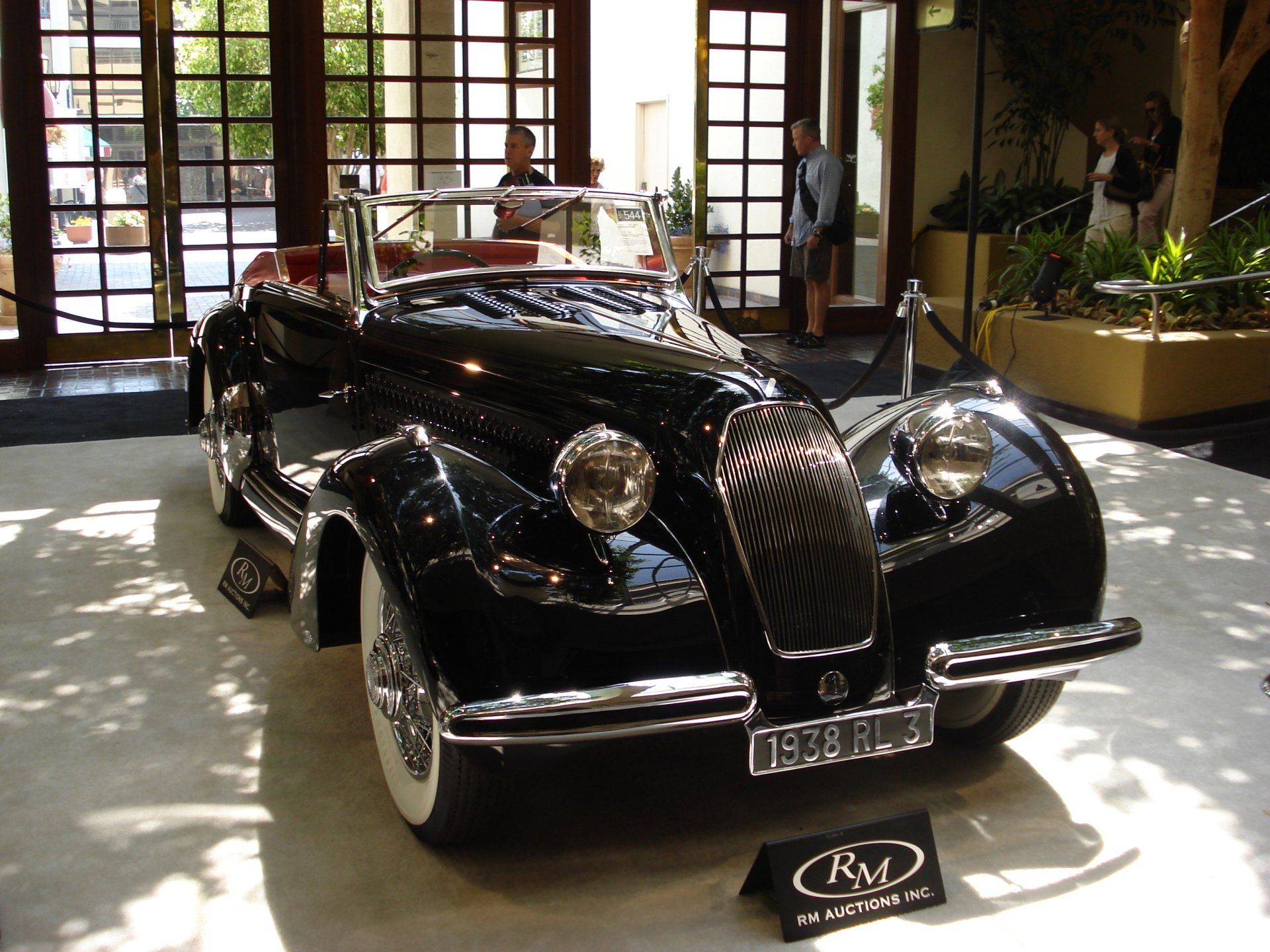 A black car with a license plate that says rv on it