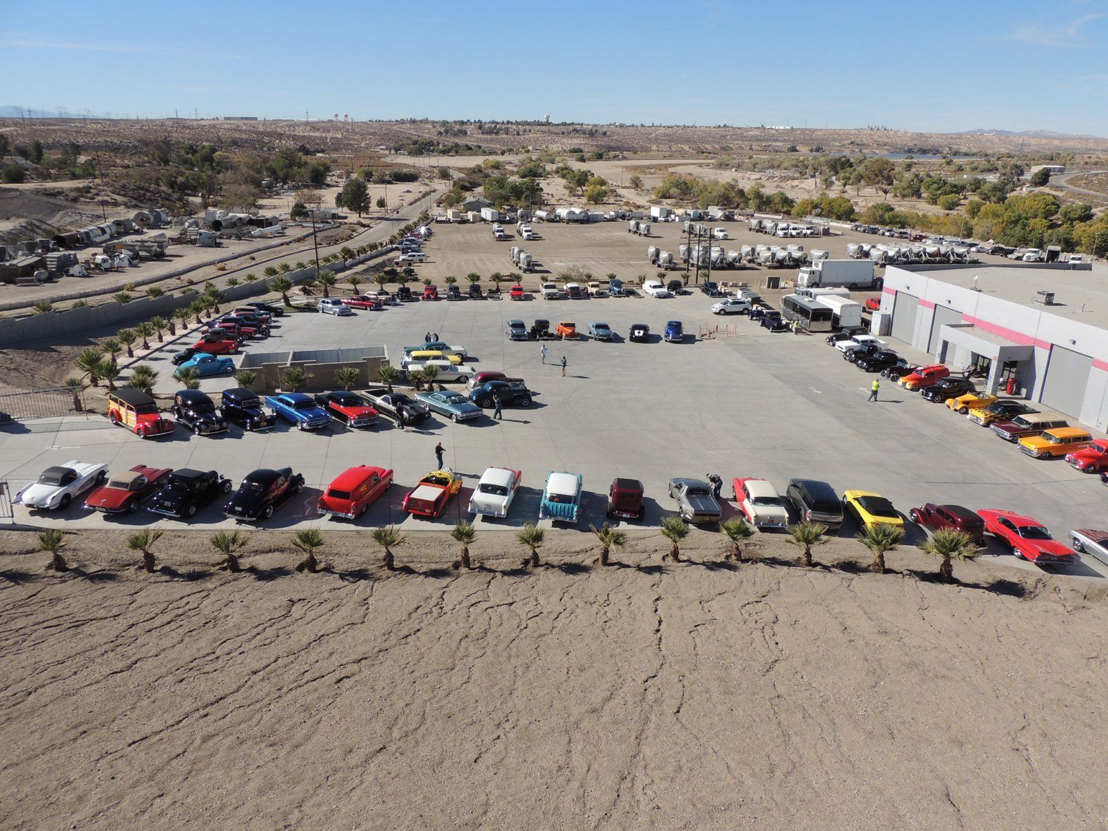 An aerial view of a parking lot filled with cars