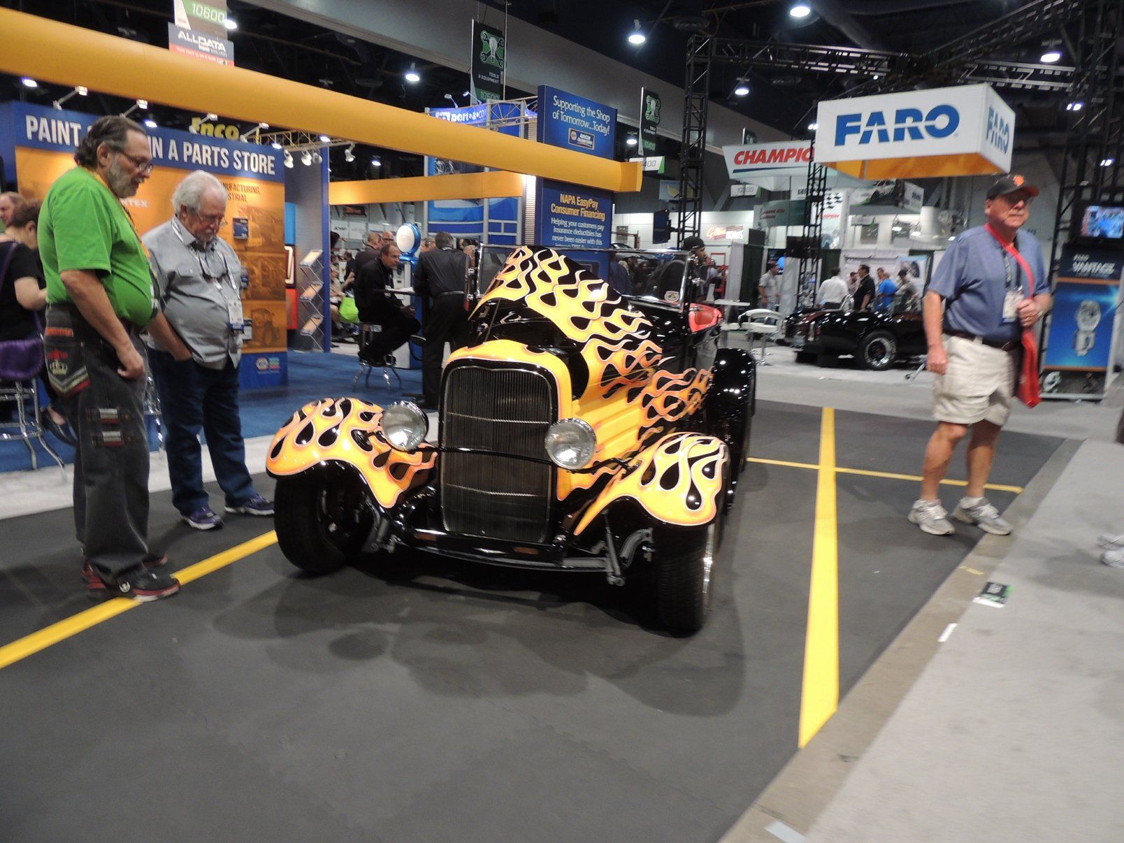 A leopard print car is on display at a car show