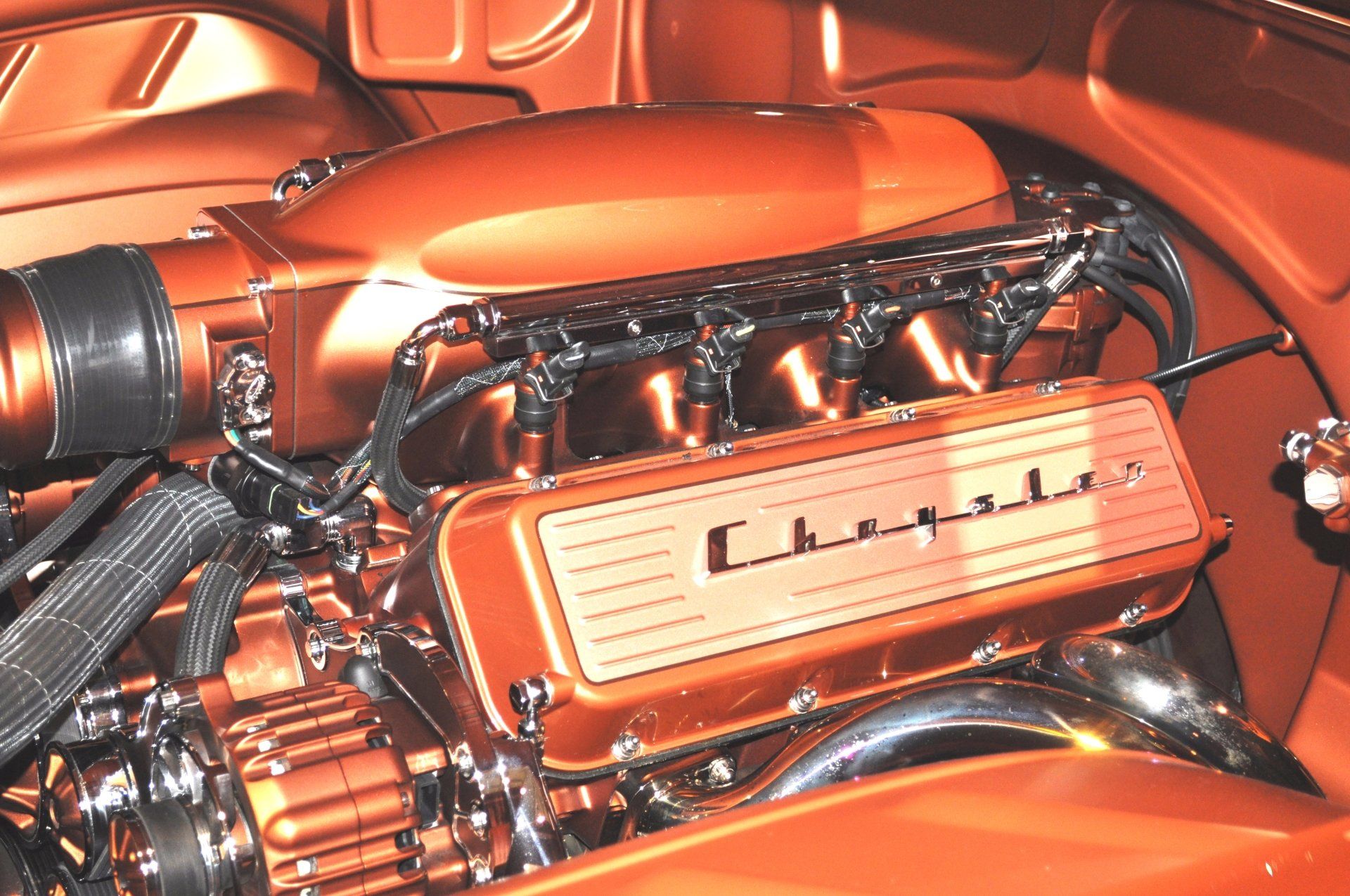 A close up of a chrysler engine in a car