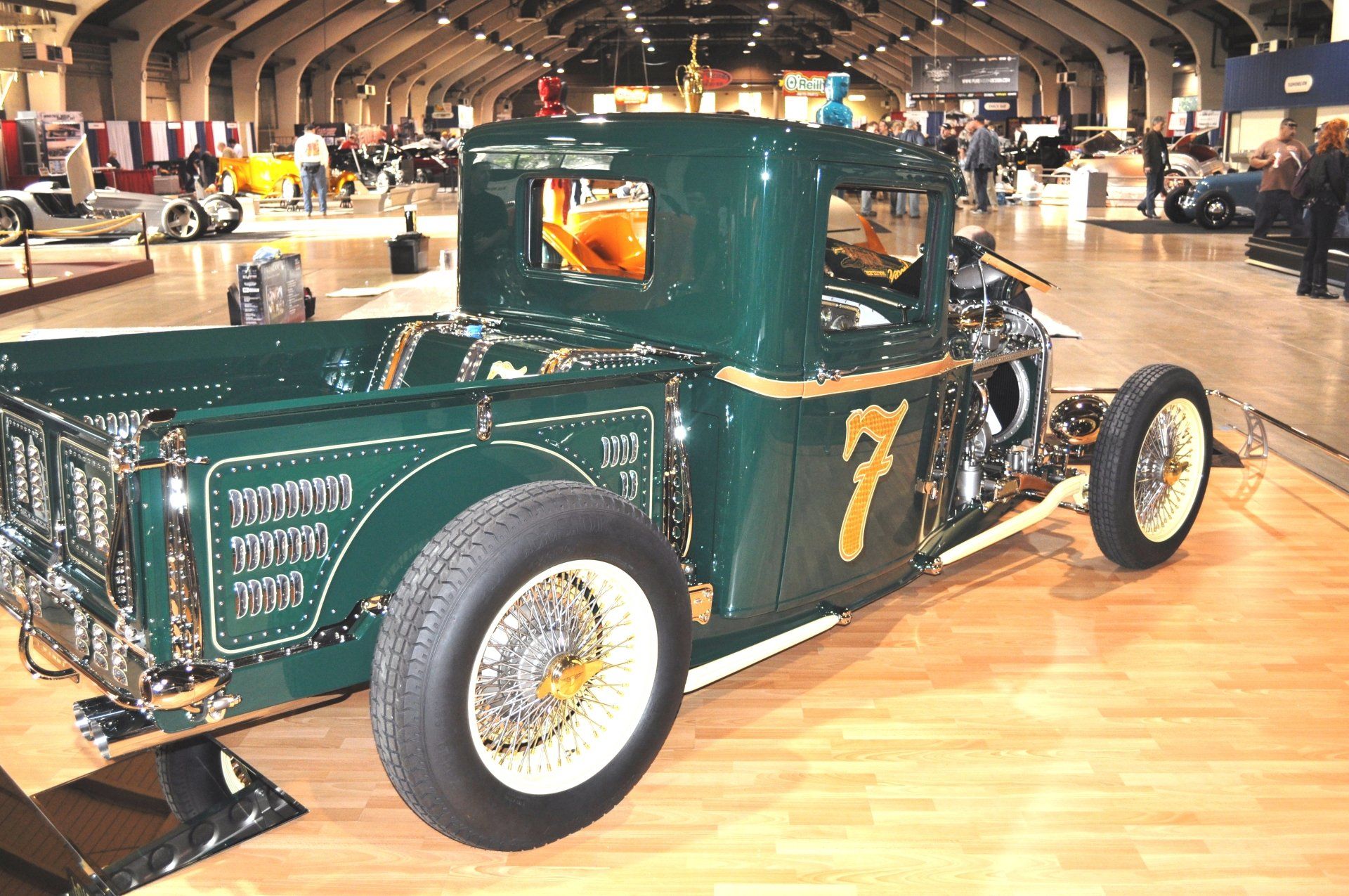 A green truck with the number 7 on the back