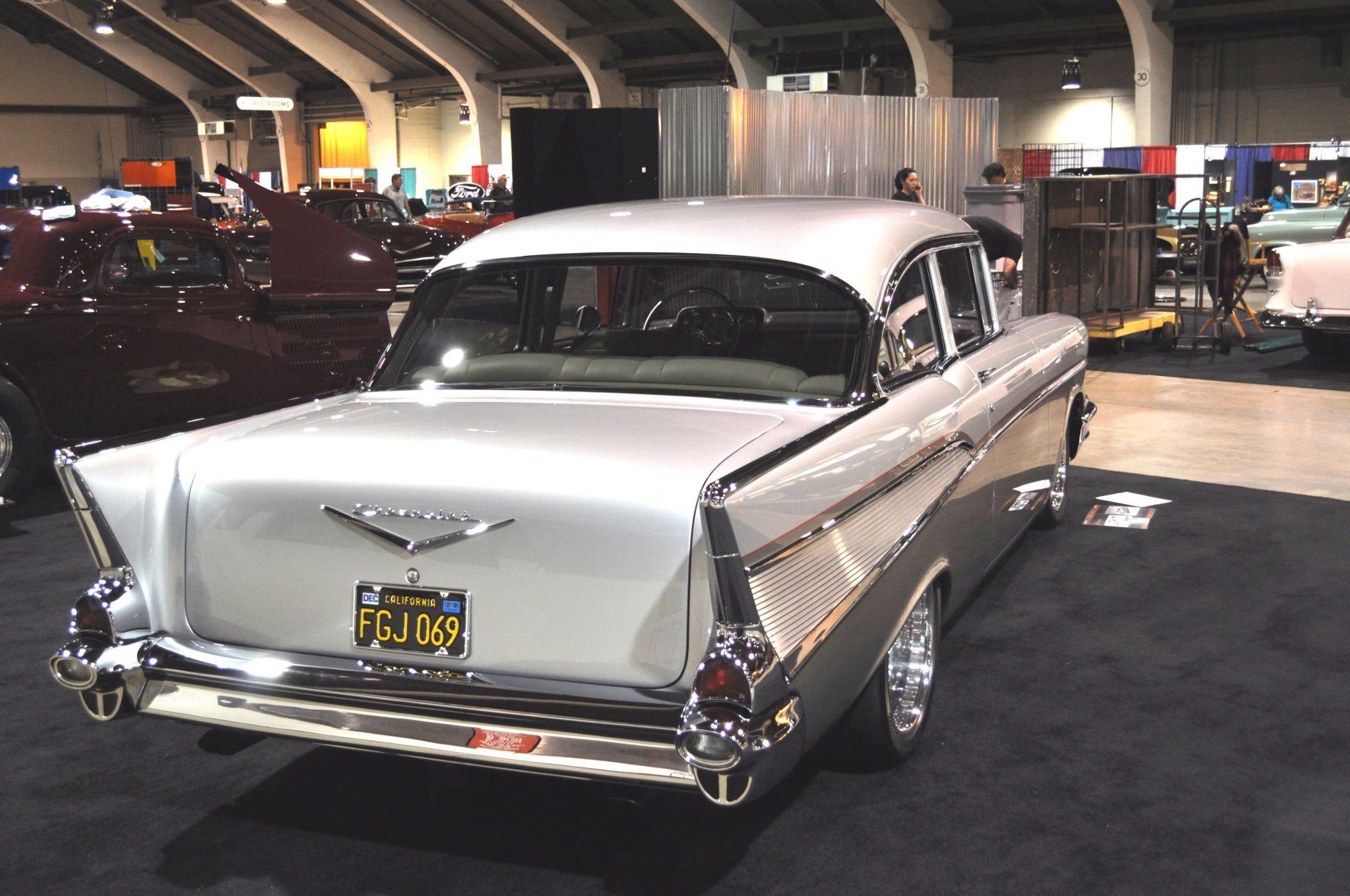 A silver car with a california license plate