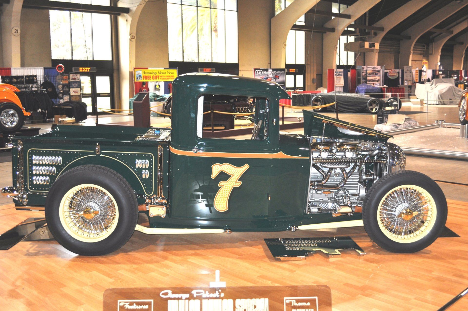 A green truck with the number 7 on the side