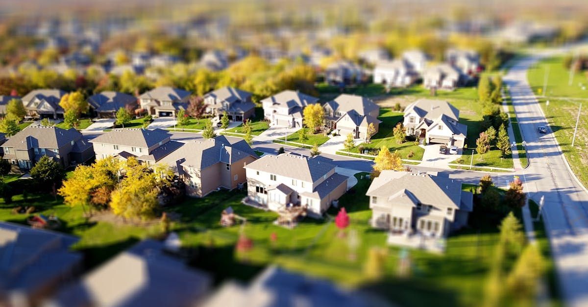 An aerial view of a residential neighborhood with lots of houses and trees.