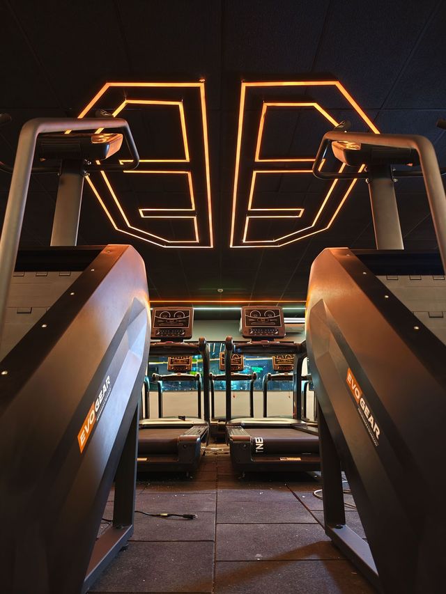 One gym with mats evogear and a sign that says ae