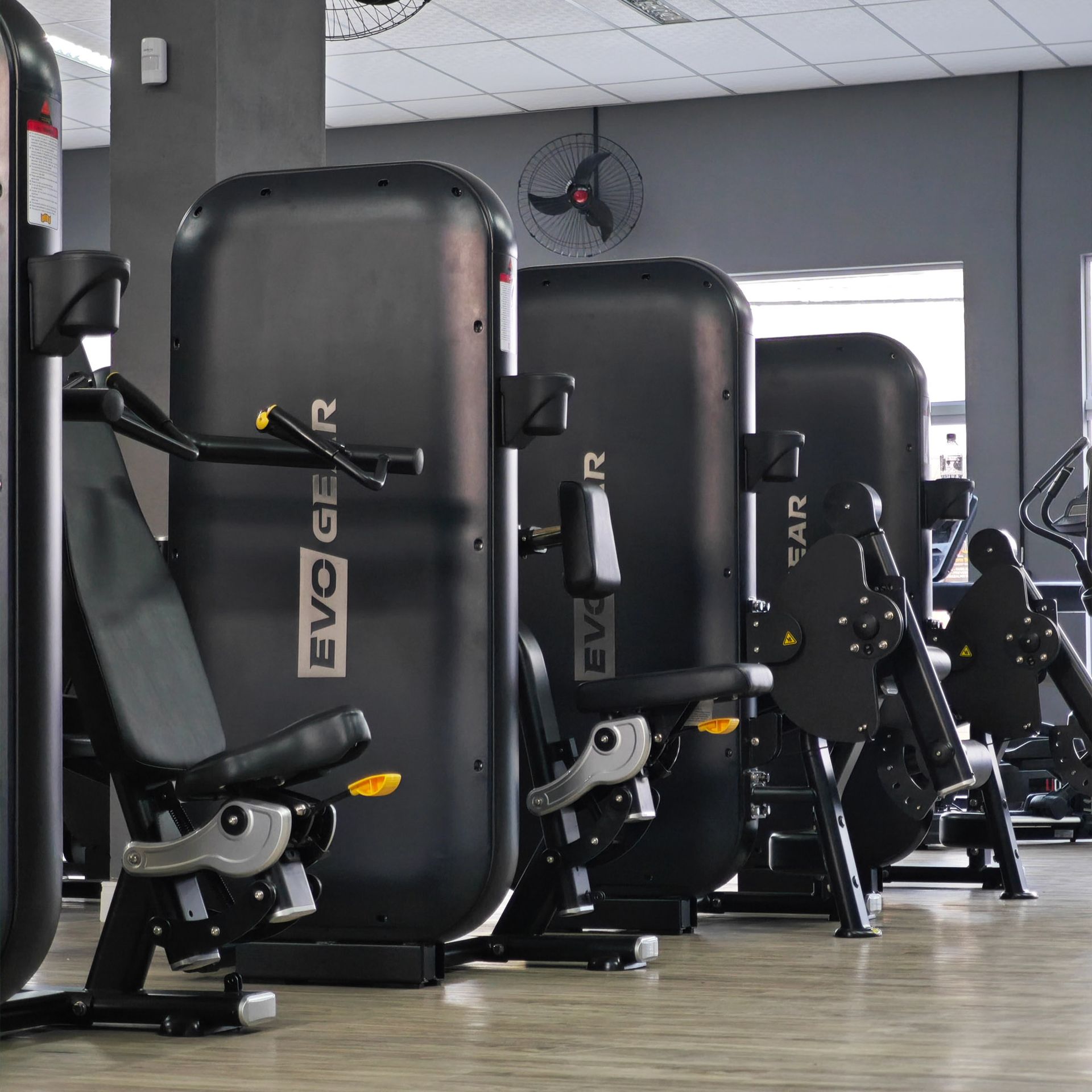 A row of evoger exercise machines in a gym