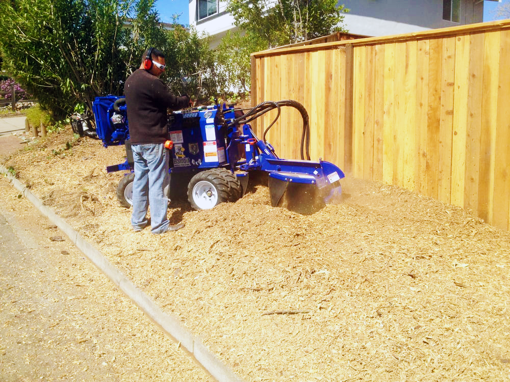 Timberland Tree Care equipment chipping wood