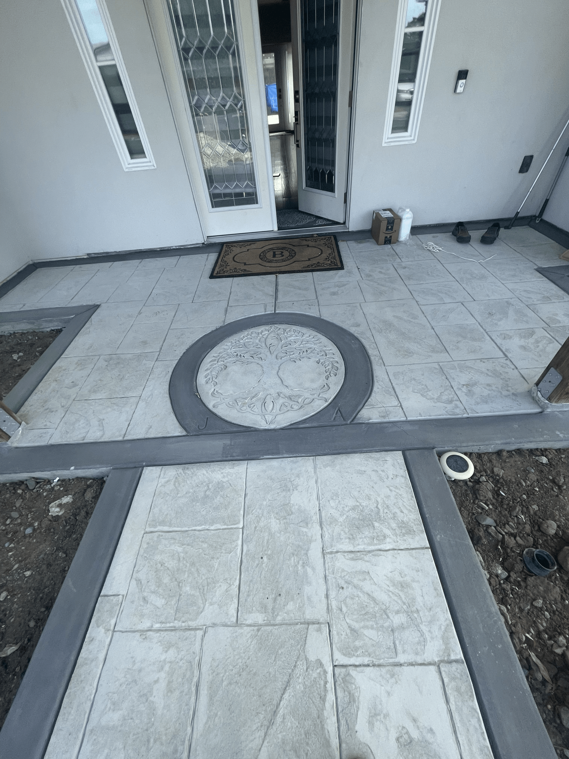 Timberland Tree Care installing a decorative concrete walkway