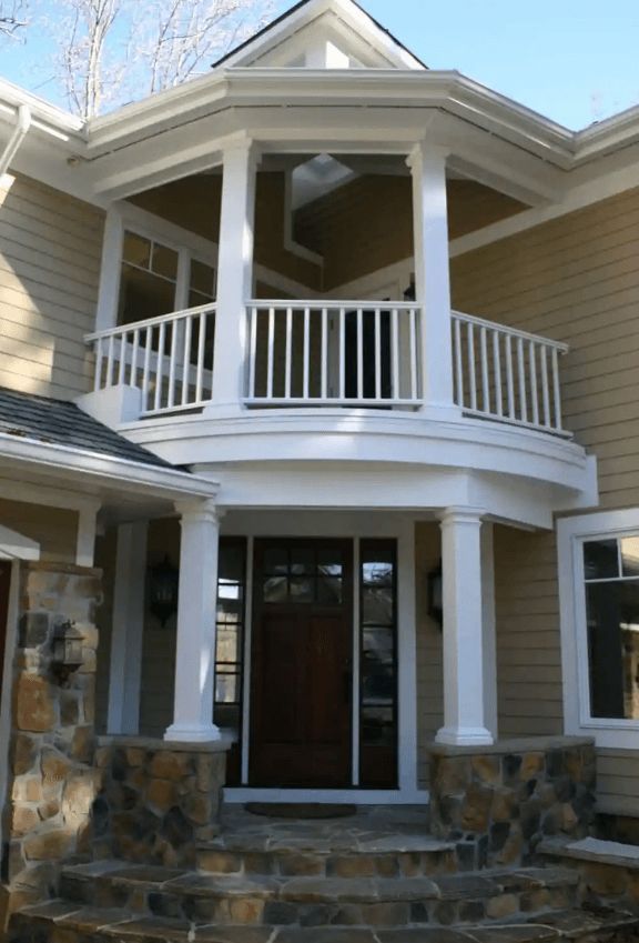 A house with a balcony over the front door