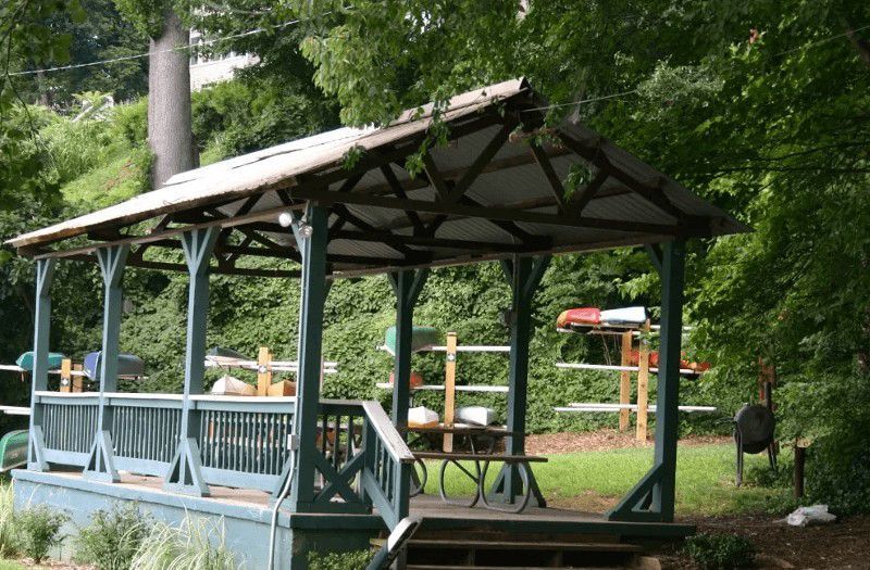 A gazebo with a picnic table underneath it