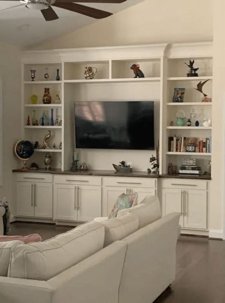 A living room with a couch and a flat screen tv