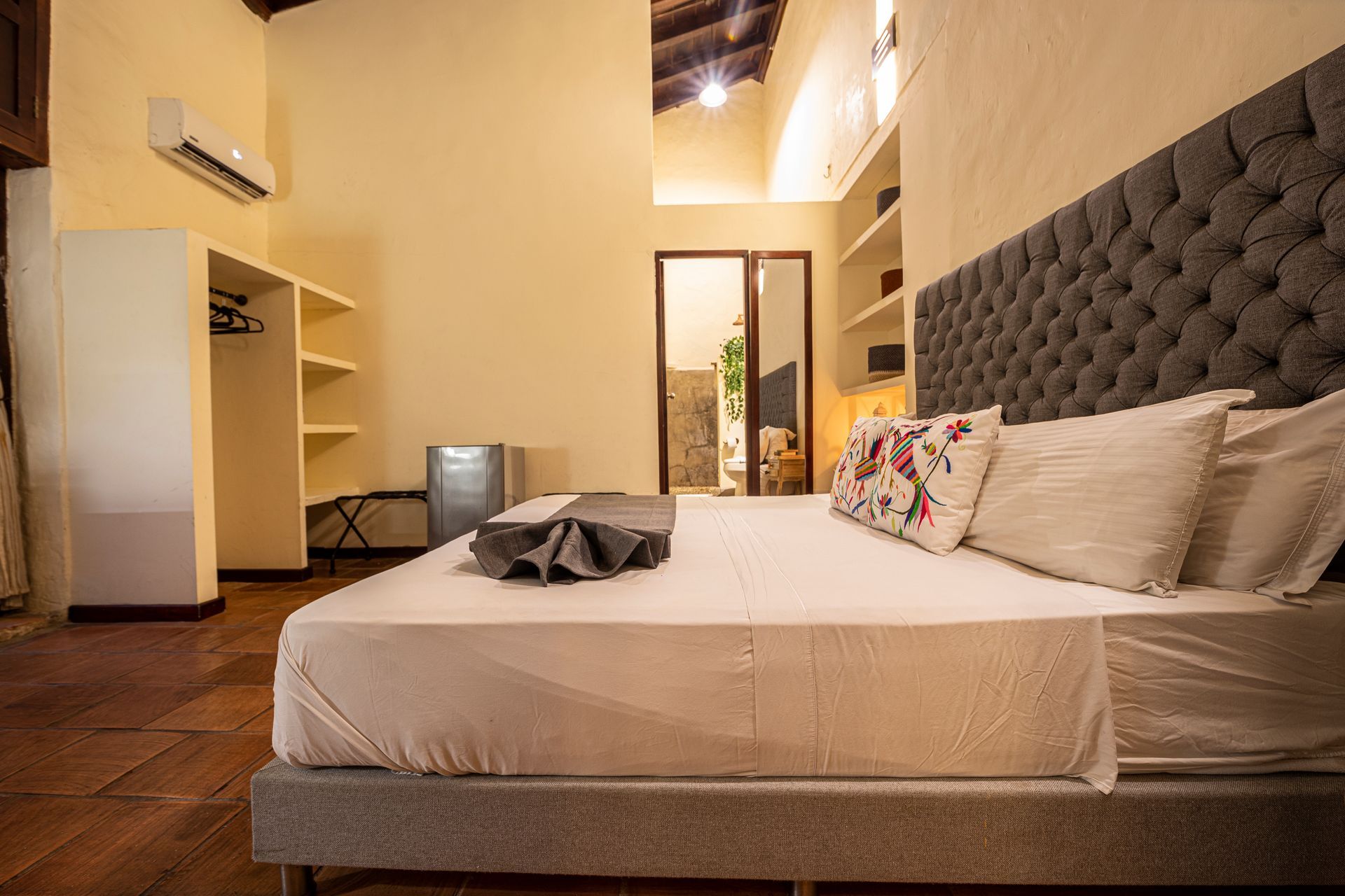 There is a large bed in the middle of the room.