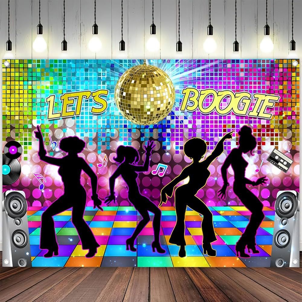 DJ booth with colorful LED screens and purple uplighting at a decorated event venue