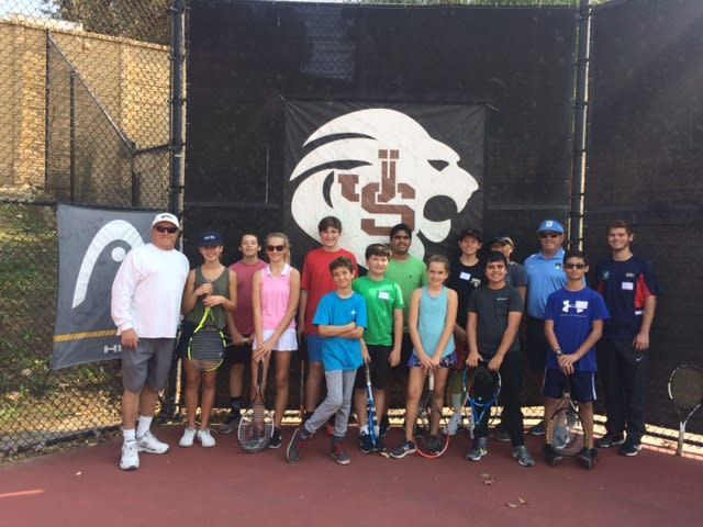 A group of people standing in front of a banner with a lion on it