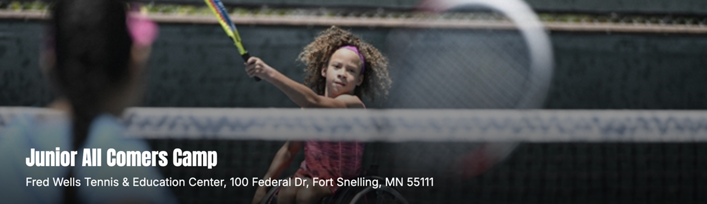 A little girl is holding a tennis racquet on a tennis court