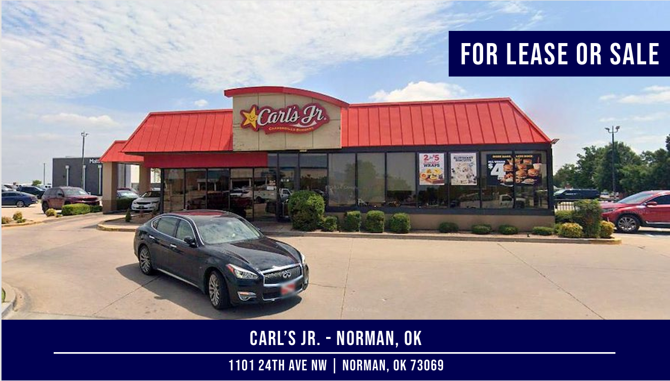 Carl's Jr. restaurant in Norman, OK, available for lease or sale. A car is parked in front.