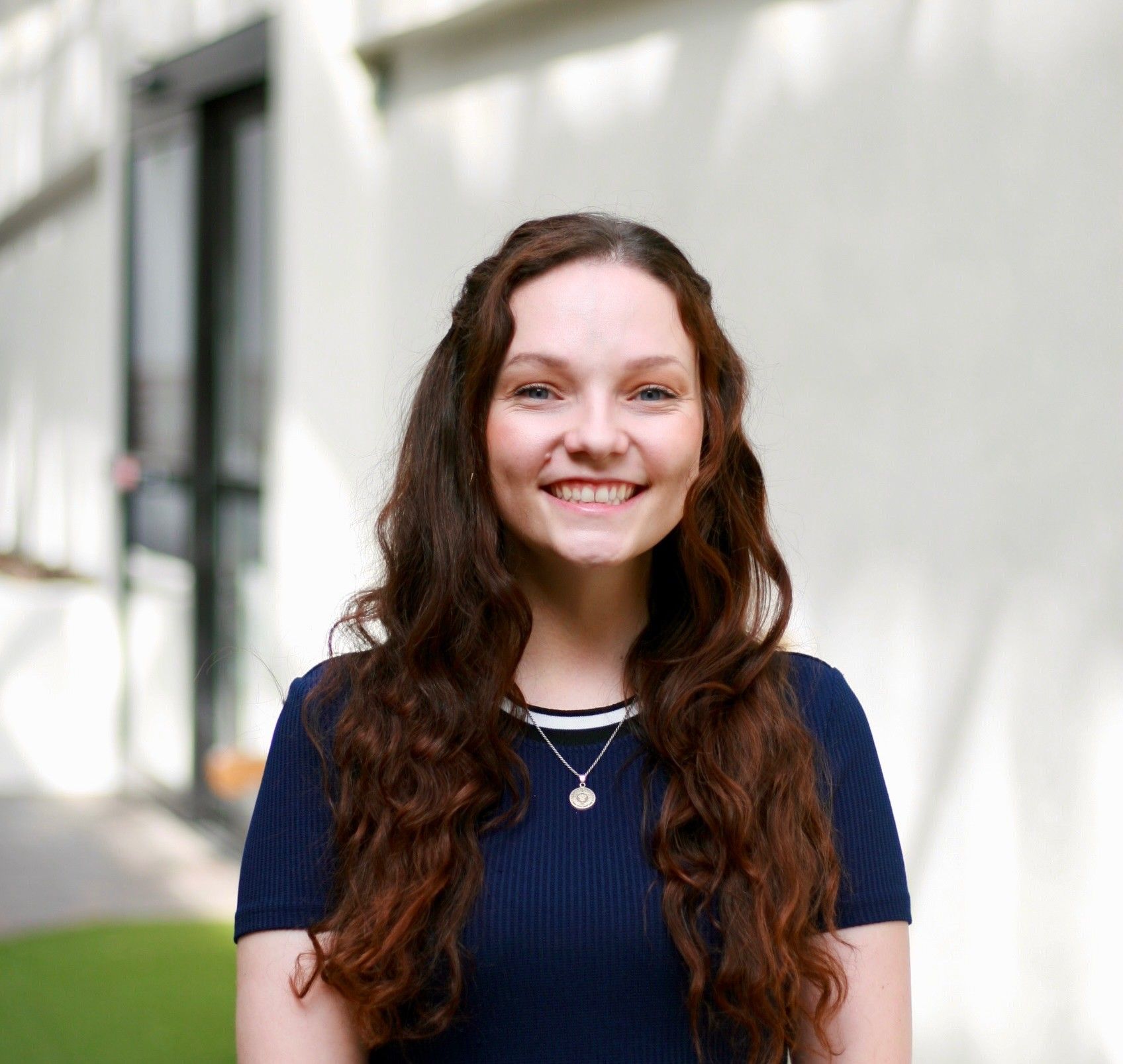 Hexagonal navy blue logo with 