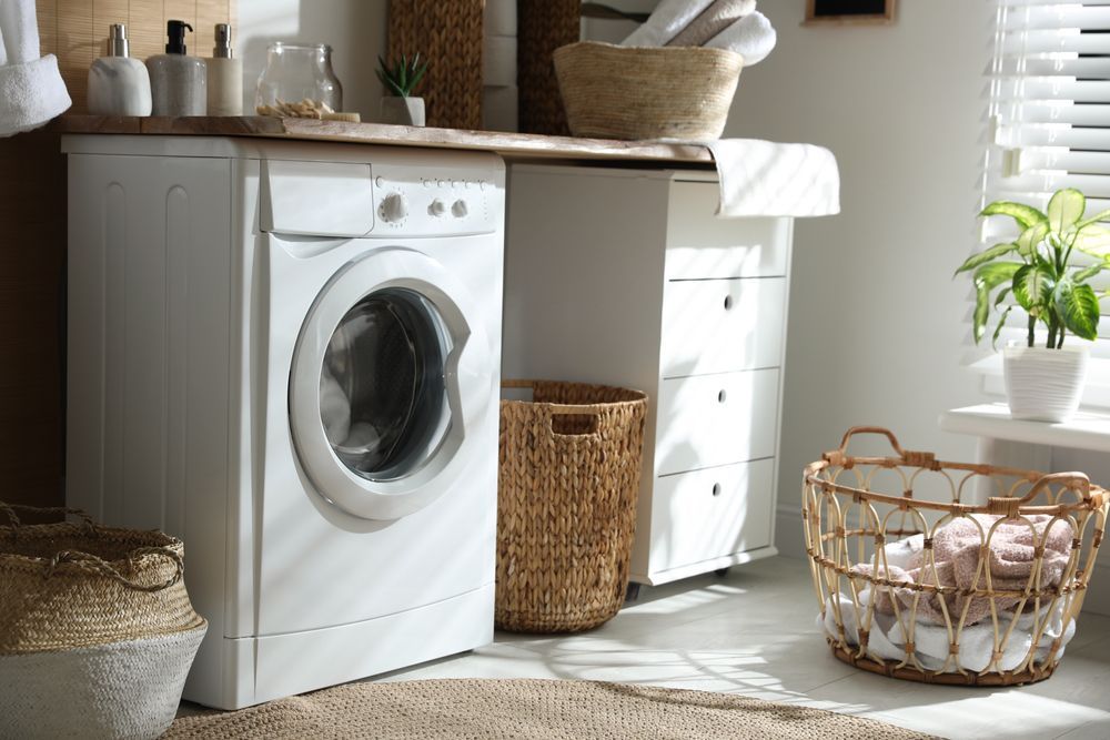 Bright Laundry Room With a White Washing Machine — Eurocoast Appliance Service In Gosford, NSW