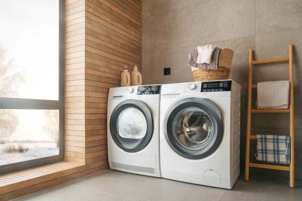 Two White Washing Machines Placed in a Modern Laundry Room — Eurocoast Appliance Service In Woy Woy, NSW