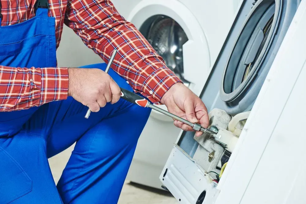 Technician in a Red Plaid Shirt and Blue — Eurocoast Appliance Service In Tuggerah, NSW