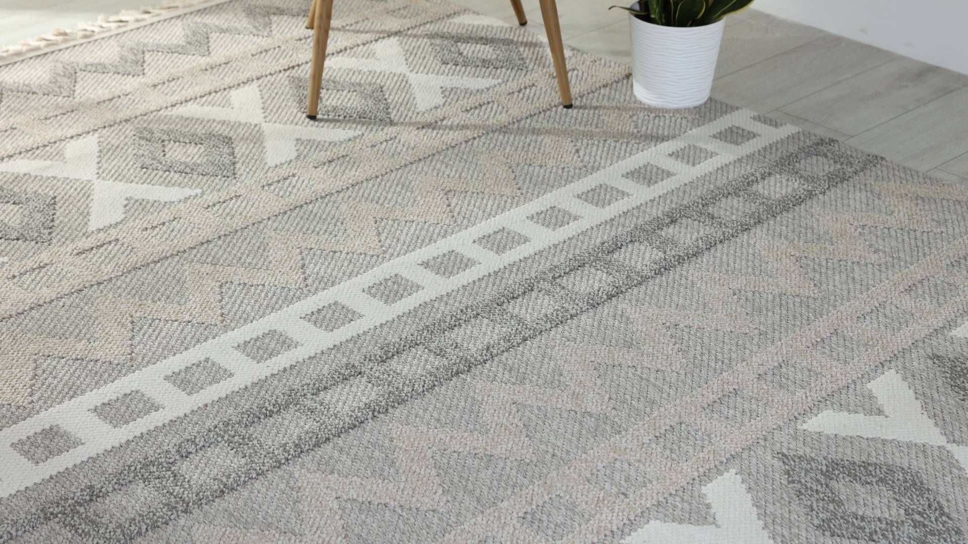 A long hallway with a puddle of water on the floor.