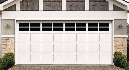 Wooden garage door repair by Monster Overhead Doors