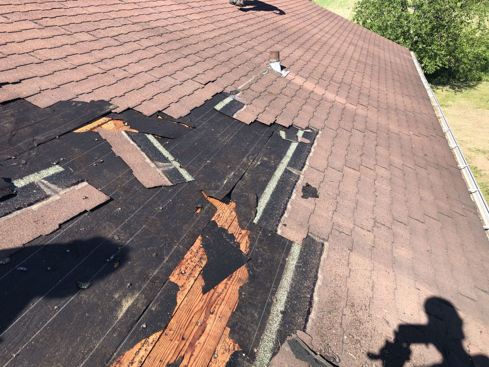 Roofing contractors installing shingles in Dane County