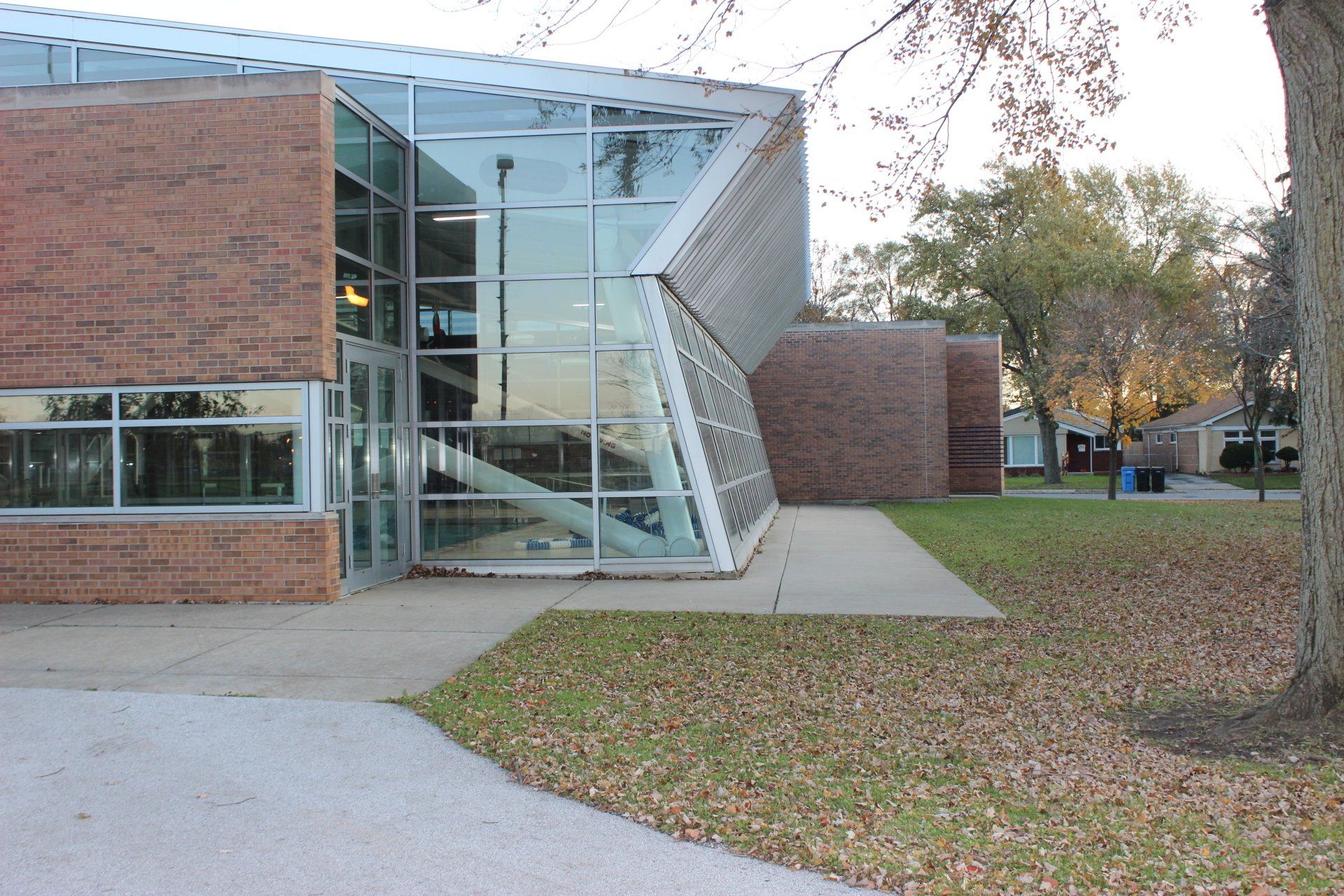 A brick building with a glass roof and stairs