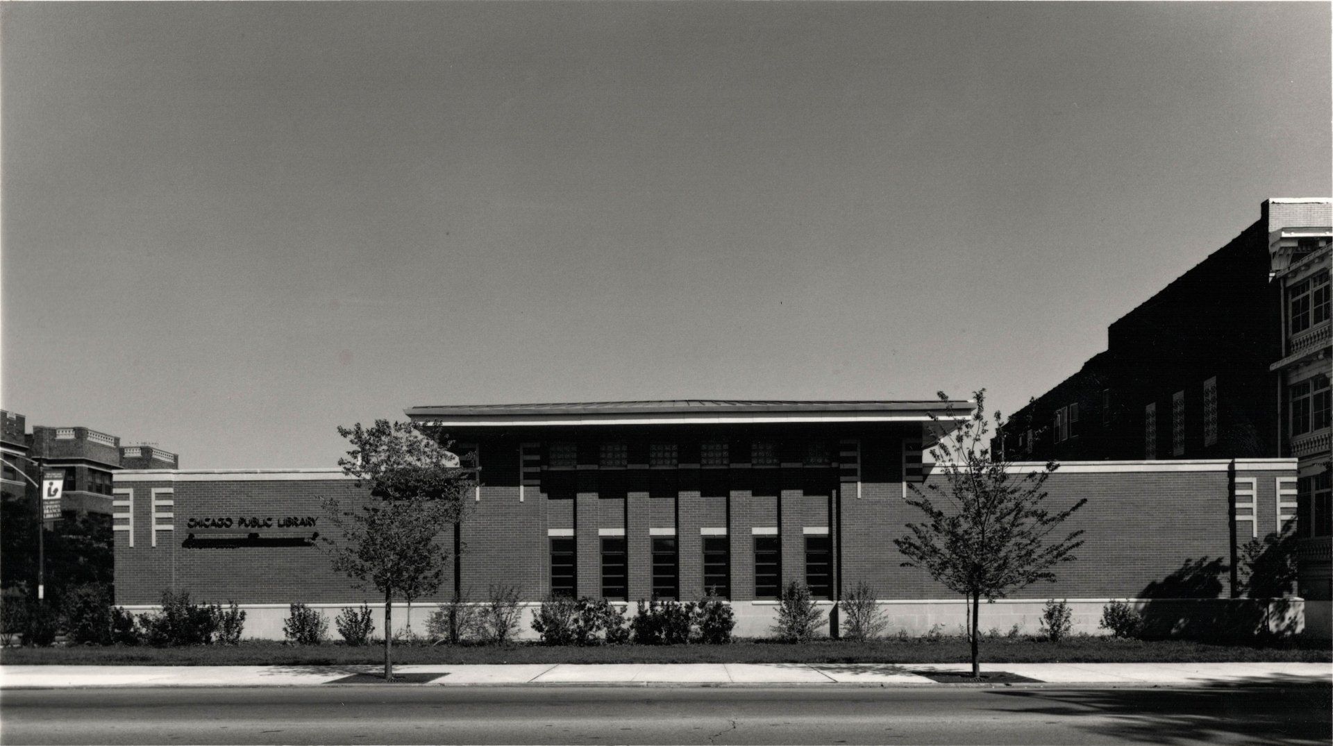 A black and white photo of a large brick building