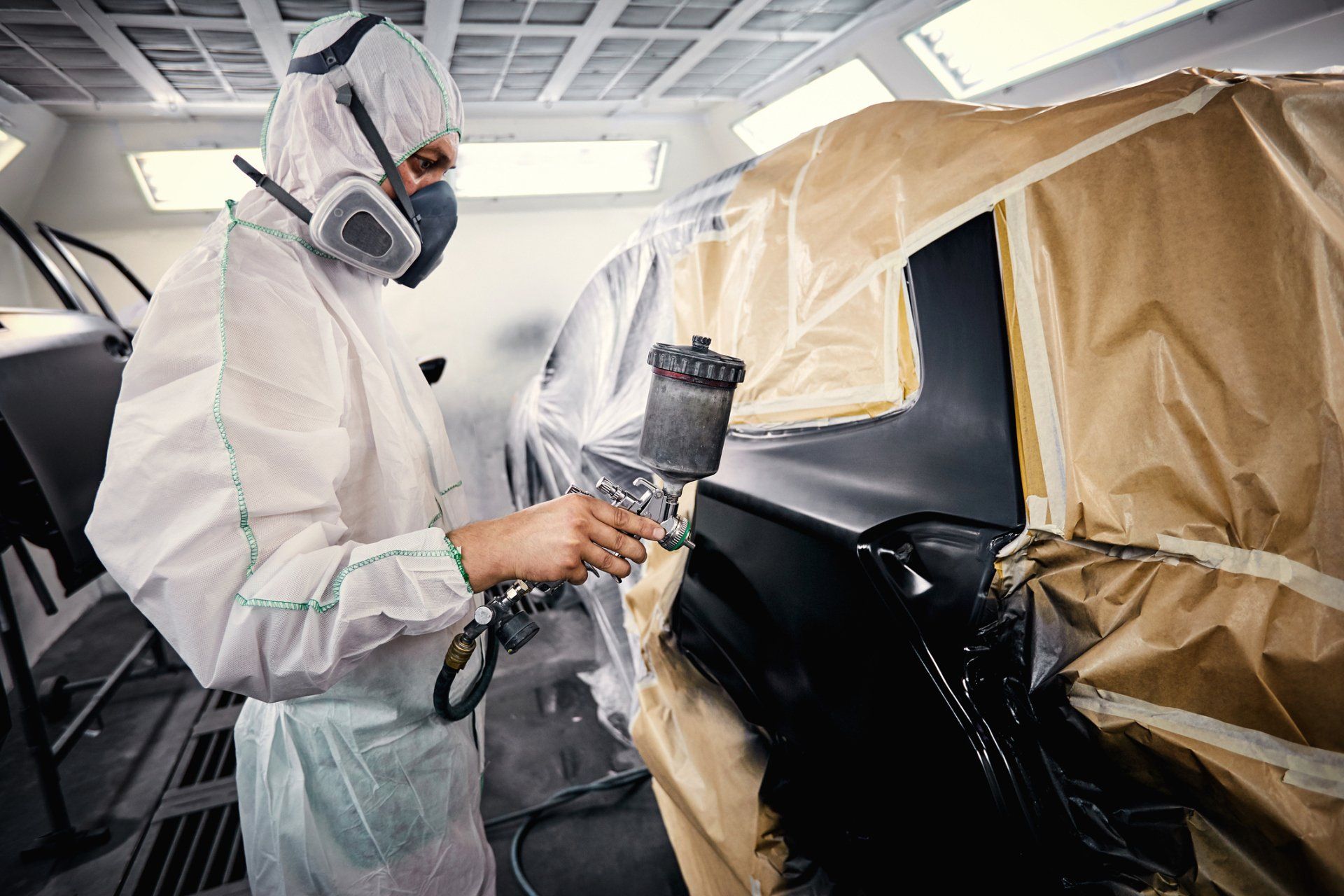 Spray Painting a Car — Plainfield, IL — Contours Auto Body