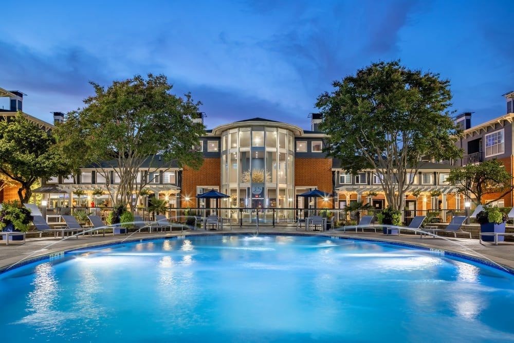a large swimming pool in front of a building at Marquis on Gaston in Dallas, TX.