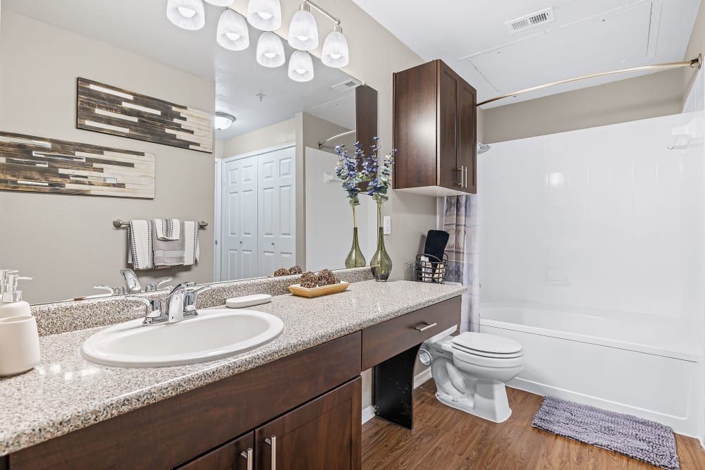 a bathroom with a sink, toilet, and bathtub at Marquis on Gaston in Dallas, TX.
