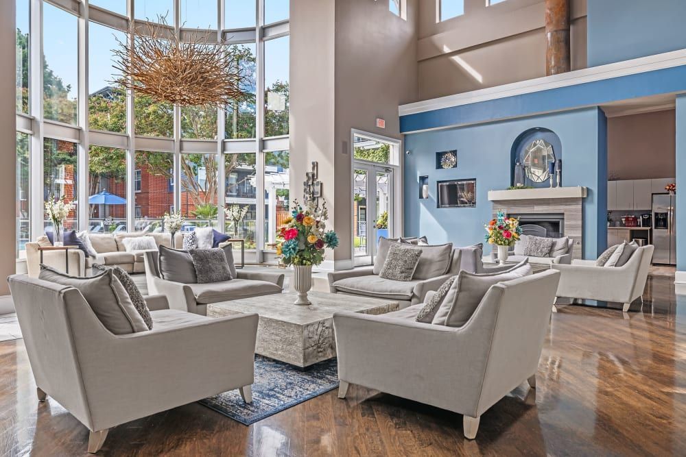 a living room filled with furniture and a fireplace at Marquis on Gaston in Dallas, TX.