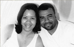 A black and white photo of a man and woman posing for a picture