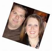 A man and a woman are posing for a picture together.