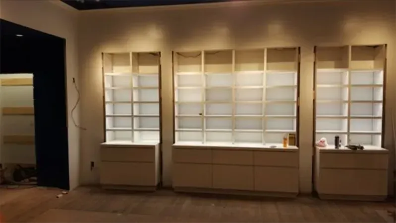 A room with a lot of shelves and drawers