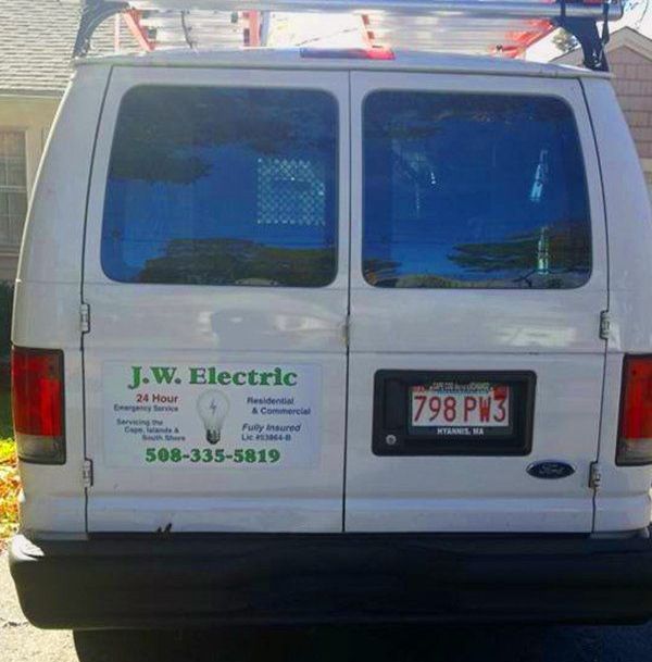 A white van with a license plate that says 798 pw3