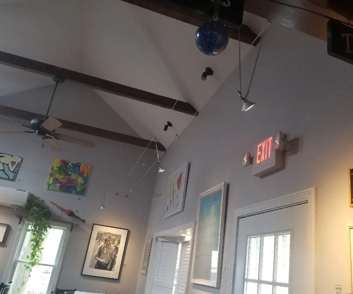 A room with a red exit sign on the wall