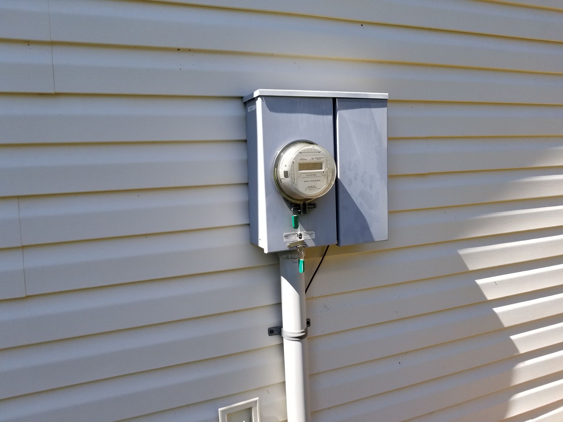 A meter is attached to the side of a house