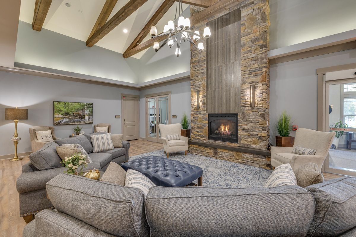 A living room filled with furniture and a fireplace.