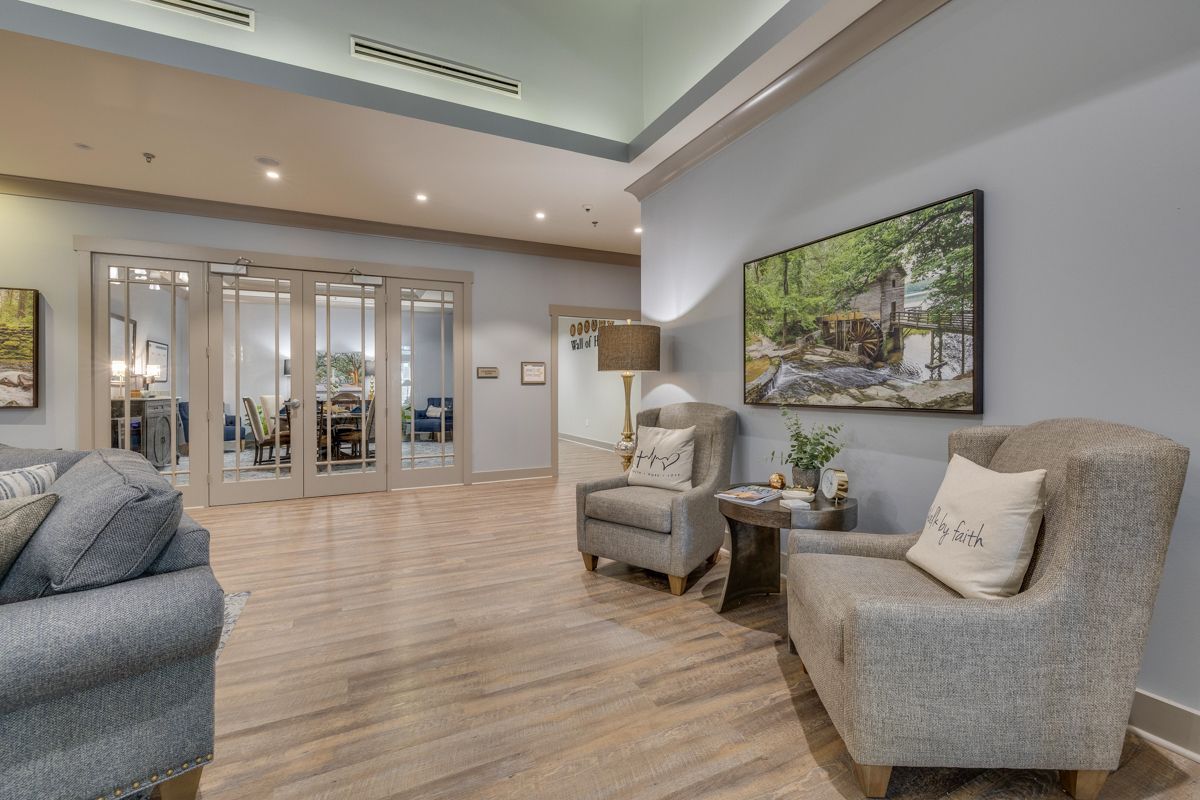 There are two chairs and a couch in the living room.