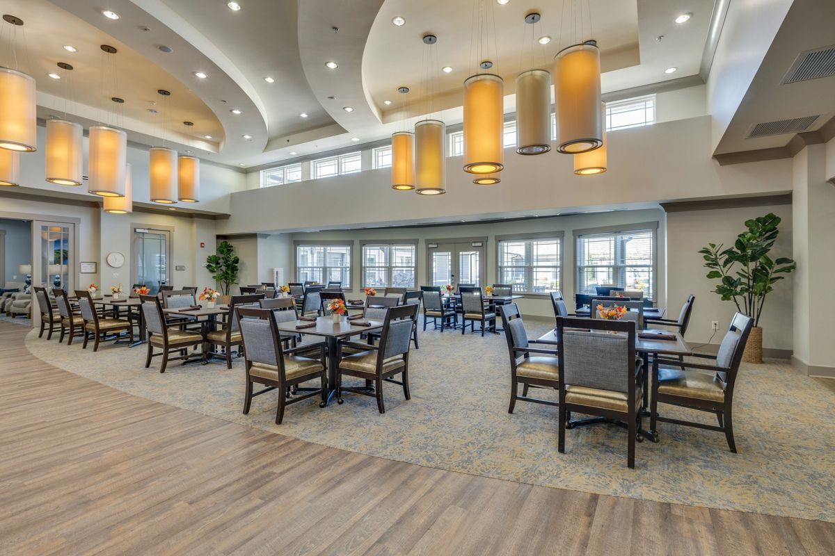 A large dining room filled with tables and chairs.