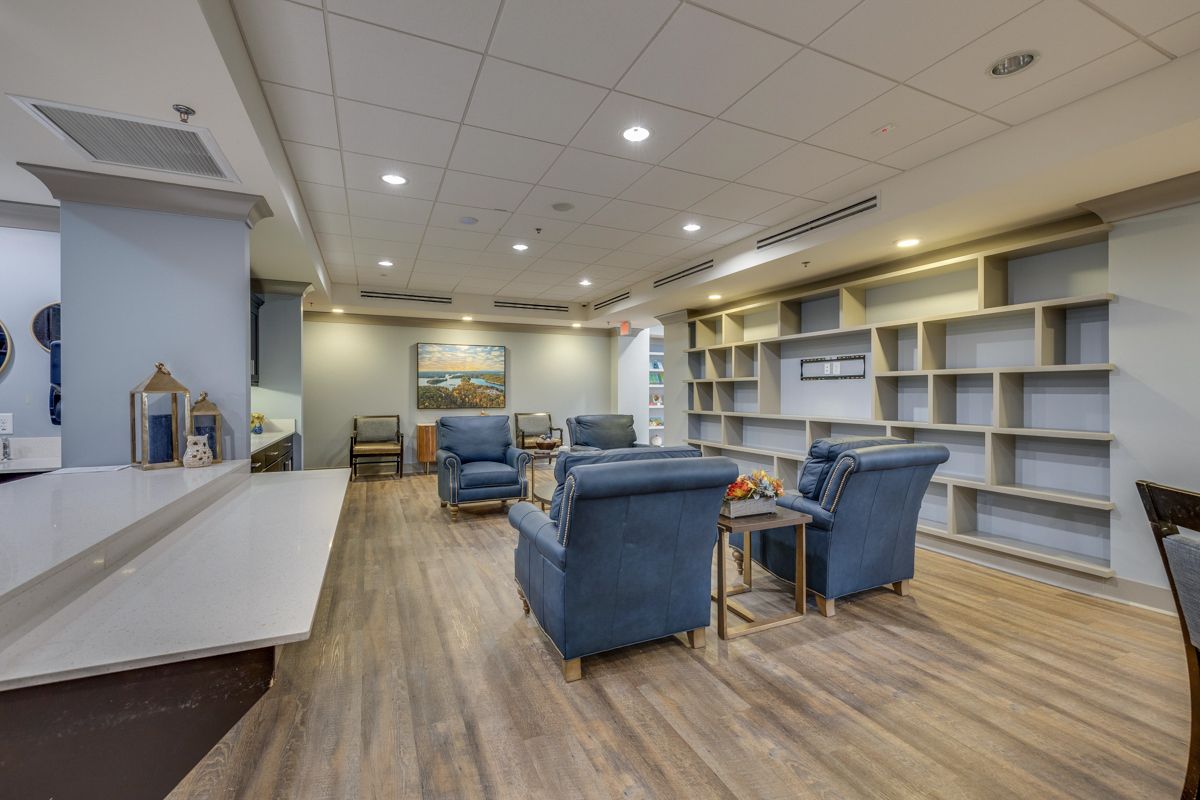 A living room filled with furniture and a pool table.