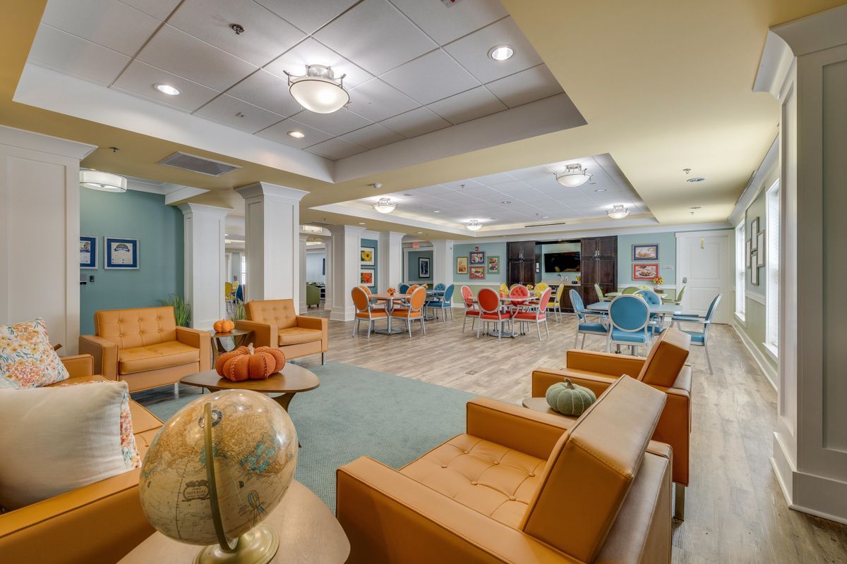 A living room filled with furniture and a globe on a table.